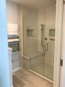 Picture of a spa-like bathroom with a shower that was recently converted from a bathtub.