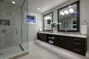 Amazing gray master bathroom with large glass walk-in shower large dual vanity with mosaic backsplash. Northwest USA